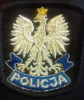 Zdjęcie kolorowe, przedstawiające czapkę policjanta.