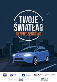 Zdjęcie kolorowe, przedstawiające plakat akcji &quot;Twoje Światło-Nasze Bezpieczeństwo&quot;.