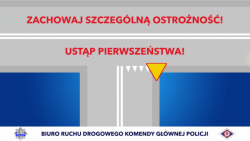 Zdjęcie kolorowe, przedstawiające drogę oraz napisy: &quot;Zachowaj szczególną ostrożność&quot; oraz &quot;Ustąp pierwszeństwa&quot;.