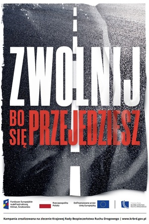 Zdjęcie plakatu, na której jest widoczna droga.